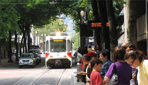 street car and people at the bus stop